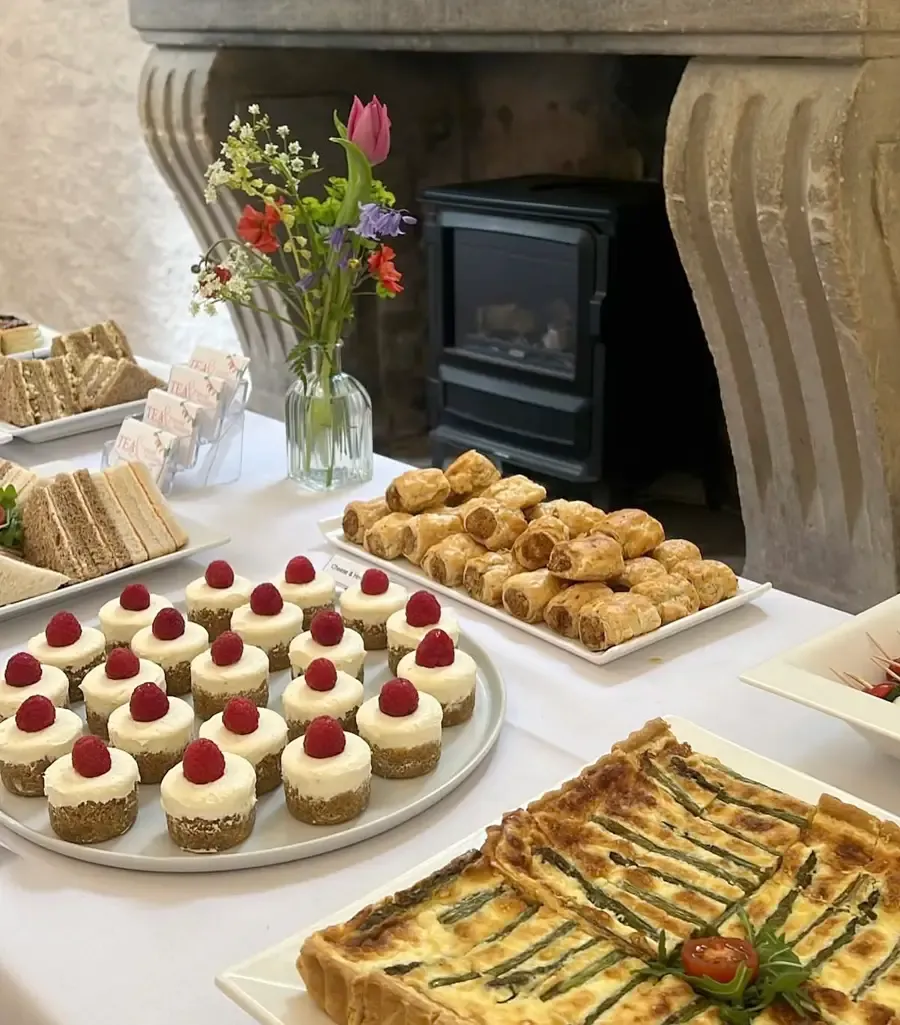 A table of quiche and cakes