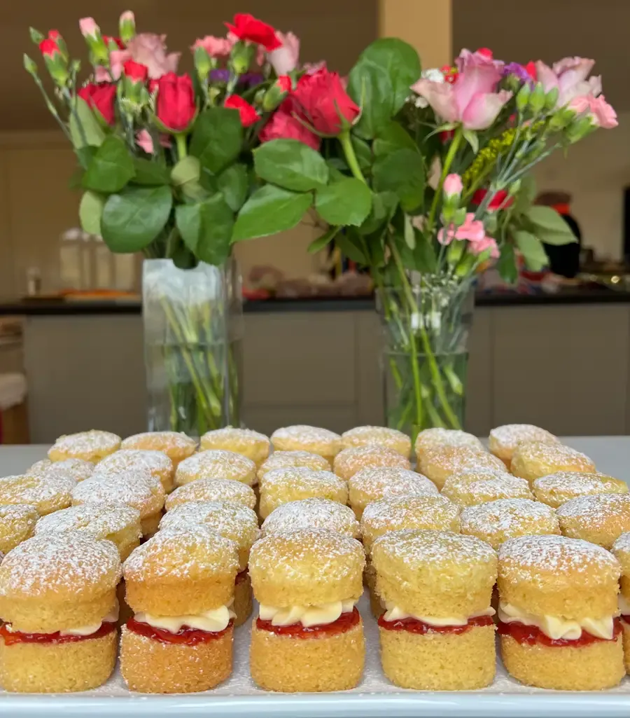 A plate of small Victoria sponges